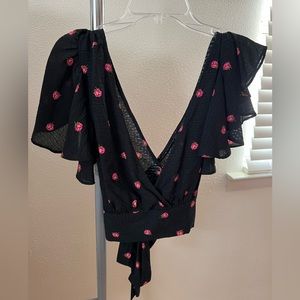 Never worn beautiful black rose croptop shirt, w/ zipper on side & bow on back!
